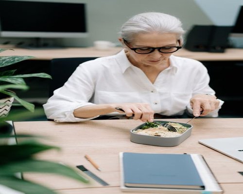 Person preparing a healthy lunch box for the office