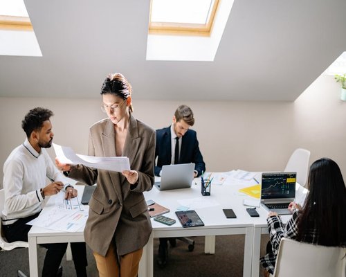 Editorial team working together in a bright office space